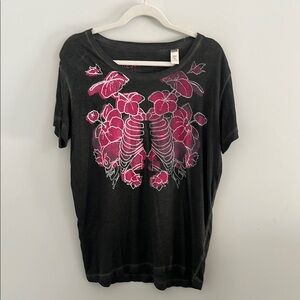 Diesel tshirt design features pink hibiscus surrounding a‎ skeletal rib cage.